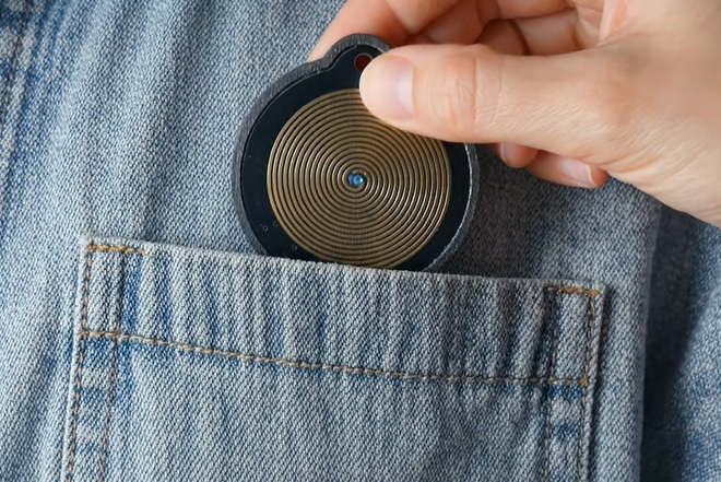 Pendant being placed in pocket